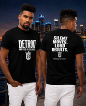 DETROIT MOVES IN SILENCE